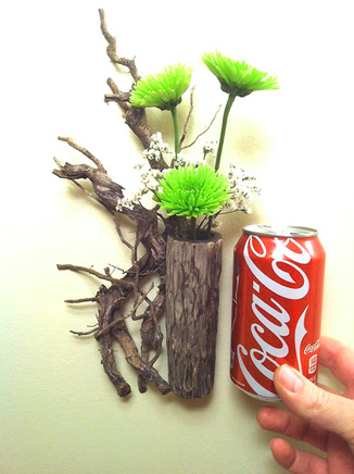 Ikebana relief flower arrangement and coke can for comparrison